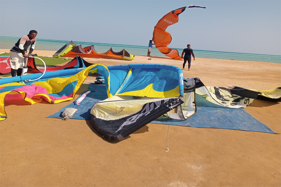 Group of kitesurfers launching their kites