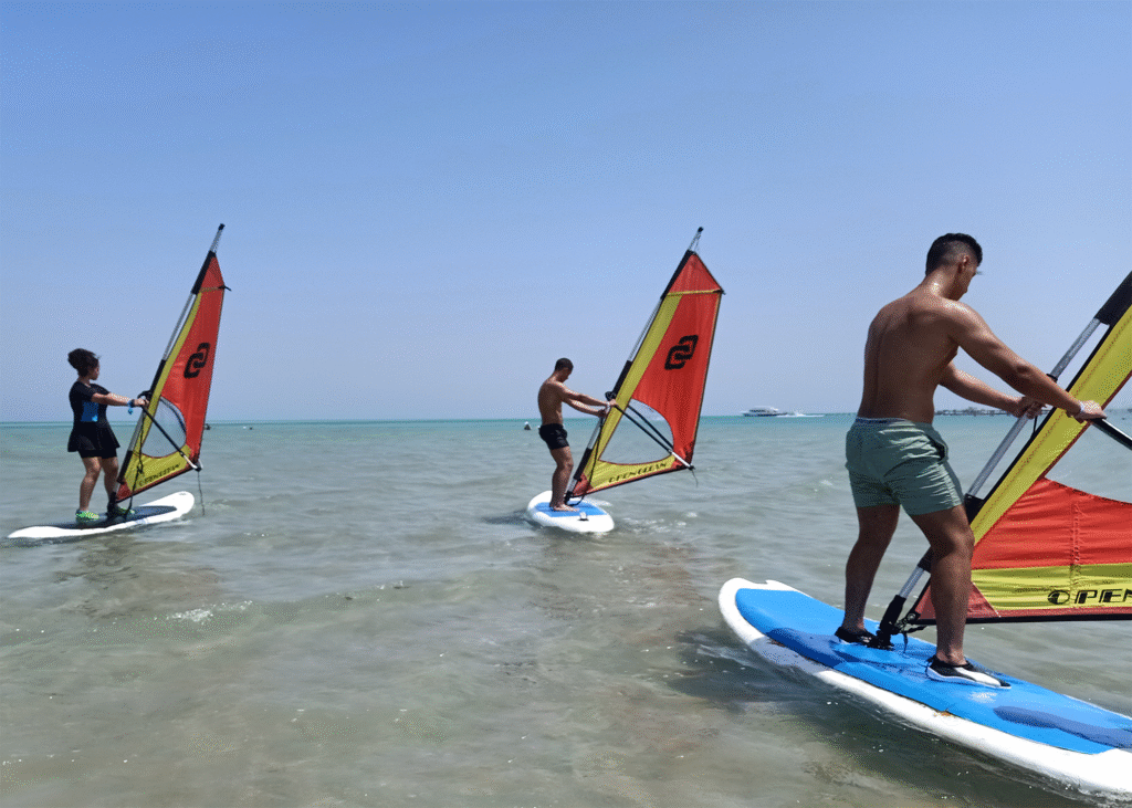 Group of windsurfers gliding on the Red Sea at Masters Surf School Hurghada