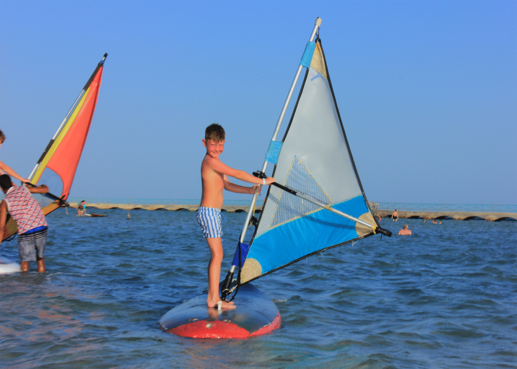 Child windsurfing on the Red Sea at Masters Surf School Hurghada