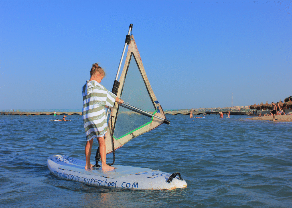 Young girl windsurfing on the Red Sea in Hurghada