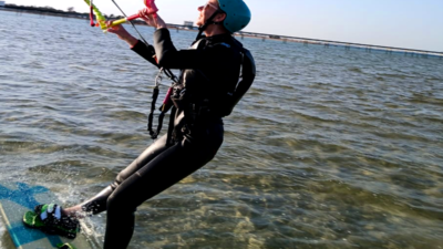 Beginner kitesurfer learning in shallow lagoon Hurghada
