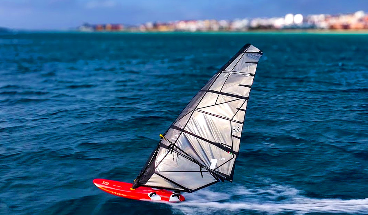 Windsurfer sailing across turquoise water at Soma Bay Hurghada Best Hurghada Windsurfing