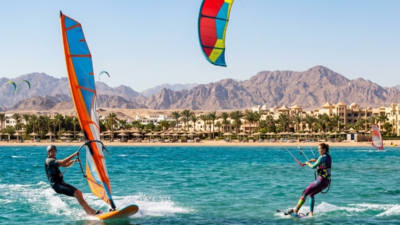 Windsurfer and kitesurfer sharing the same spot in Hurghada Egypt