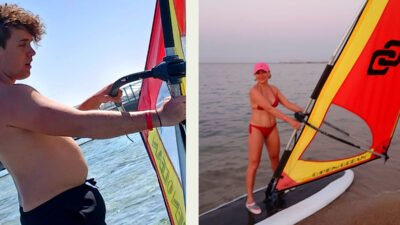 Beginner windsurfer standing on a large volume board in shallow Hurghada waters