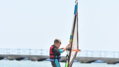 Beginner windsurfing lesson in waist-deep water at Al Ahyaa Lagoon, Hurghada