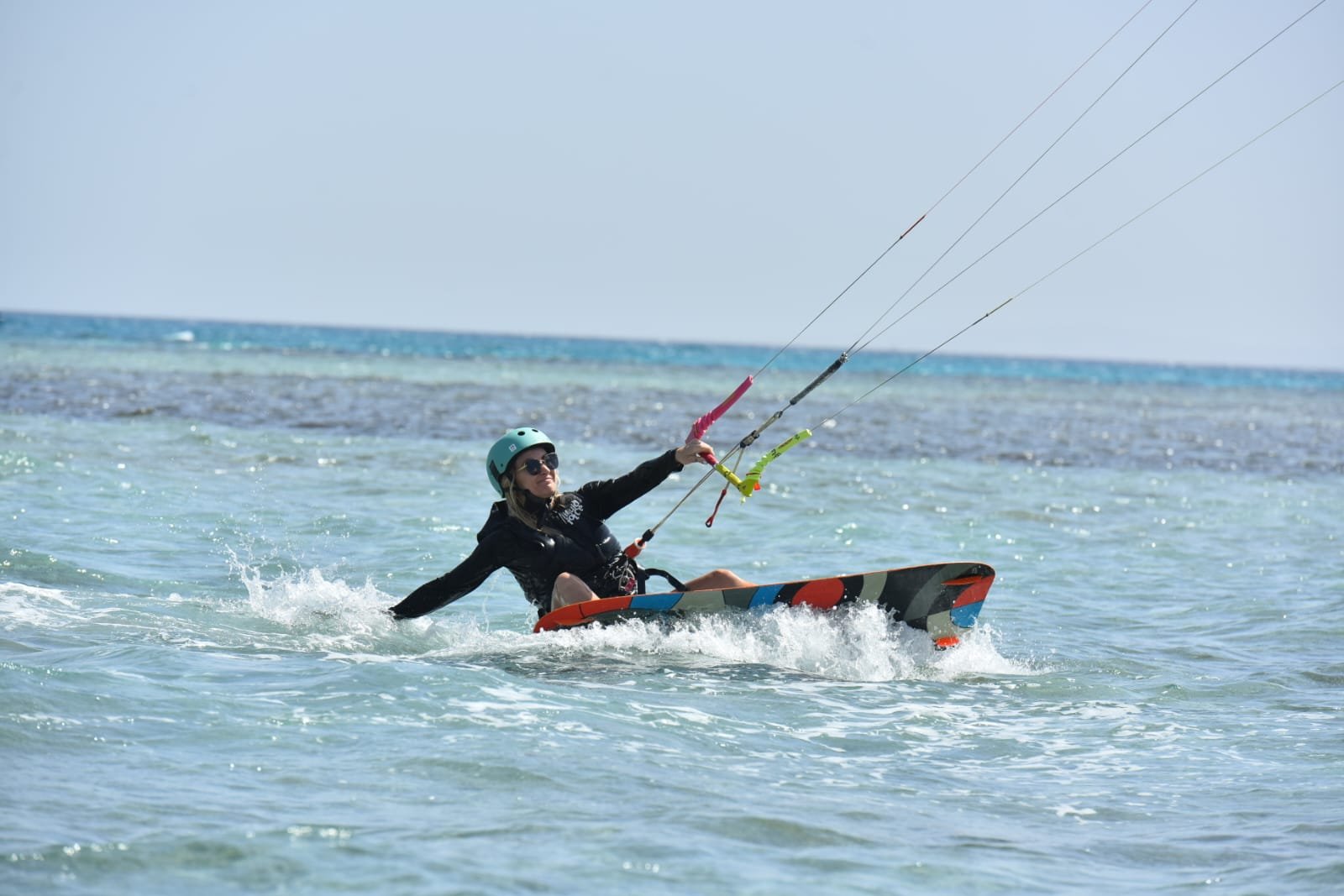 Advanced kitesurfer performing grab jump at Al Ahyaa Lagoon Hurghada Egypt
